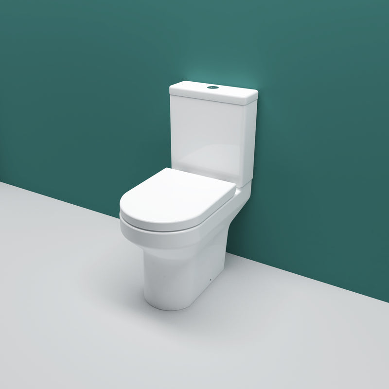 A white, modern close coupled toilet with a soft close seat and dual flush cistern against a green background.